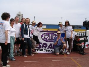 Jude, Ruth, Paul, James, Sophie, Naomi, Debbie, Dan, Ben & Martine and the original JfJfP banner at Mile End Stadium